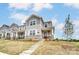 Charming two-story townhouse with stone accents, a covered front porch, and landscaped yard at 3936 Cheyney Park Dr, Charlotte, NC 28269