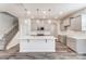 Bright kitchen with grey cabinets, quartz countertops, stainless appliances and island at 3936 Cheyney Park Dr, Charlotte, NC 28269