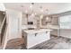 Chic kitchen with gray cabinets, a central island, and stylish pendant lighting at 3936 Cheyney Park Dr, Charlotte, NC 28269