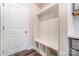 Functional mudroom with a built-in bench, coat hooks, and storage cubbies at 3936 Cheyney Park Dr, Charlotte, NC 28269