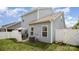 Exterior view of a two-story home with light blue siding and green grass at 40154 Crooked Stick Dr, Lancaster, SC 29720
