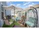 Cozy outdoor patio featuring a table, grill, hanging chair and comfortable seating, perfect for relaxation at 40154 Crooked Stick Dr, Lancaster, SC 29720