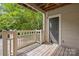 Private balcony offering an outdoor space with a wooden floor and a railing at 5011 Sharon Rd # Q, Charlotte, NC 28210