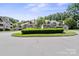 Beautiful apartment buildings with manicured landscaping and a central fountain at 5011 Sharon Rd # Q, Charlotte, NC 28210