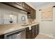 Efficient kitchen featuring stainless steel appliances, tile backsplash, and breakfast bar opening to the dining area at 5011 Sharon Rd # Q, Charlotte, NC 28210