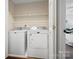 Efficient laundry area with a modern washer and dryer set and shelving at 5011 Sharon Rd # Q, Charlotte, NC 28210