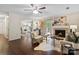 Inviting living room featuring hardwood floors, a fireplace, and access to both a balcony and bonus room at 5011 Sharon Rd # Q, Charlotte, NC 28210