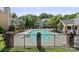 Community swimming pool enclosed by a fence, surrounded by lounge chairs at 5011 Sharon Rd # Q, Charlotte, NC 28210
