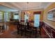 Elegant dining room connected to the living area features hardwood flooring and stylish lighting at 6017 Lowergate Dr, Waxhaw, NC 28173
