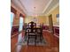Formal dining room featuring a chandelier, wainscoting, and large windows at 6017 Lowergate Dr, Waxhaw, NC 28173