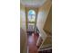View from above the foyer shows tall ceilings, grand window, and hardwood floors at 6017 Lowergate Dr, Waxhaw, NC 28173