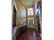 Grand foyer with tall ceilings, beautiful lighting fixture, and gorgeous hardwood floors at 6017 Lowergate Dr, Waxhaw, NC 28173