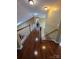 Open hallway with hardwood floors and natural lighting from skylight at 6017 Lowergate Dr, Waxhaw, NC 28173