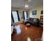 Cozy living room with hardwood floors, neutral walls, sofa, and decor at 6017 Lowergate Dr, Waxhaw, NC 28173