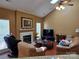 Comfortable living room with fireplace, plush seating, and natural light at 6017 Lowergate Dr, Waxhaw, NC 28173