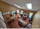 Spacious living room features skylights, fireplace, and beautiful hardwood flooring at 6017 Lowergate Dr, Waxhaw, NC 28173