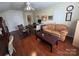 Comfortable office with sofa, ceiling fan, hardwood floors, and natural light at 6017 Lowergate Dr, Waxhaw, NC 28173
