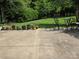 Outdoor patio with table, chairs and lush greenery at 6017 Lowergate Dr, Waxhaw, NC 28173