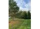 Well-maintained front yard with mature trees at 6017 Lowergate Dr, Waxhaw, NC 28173