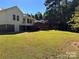 Large, grassy backyard with a two-story house and deck at 625 Wildwood Dr, Rock Hill, SC 29730