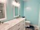 Bright bathroom features double sinks, vanity and matching framed mirror at 625 Wildwood Dr, Rock Hill, SC 29730
