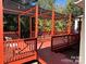 Large outdoor deck with red railings and posts at 625 Wildwood Dr, Rock Hill, SC 29730