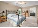Comfortable bedroom with ceiling fan, side table and adjoining bathroom at 6512 Porterfield Rd, Charlotte, NC 28226