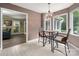 Cozy dining area with a stylish chandelier and views of the backyard at 6512 Porterfield Rd, Charlotte, NC 28226