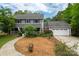 Attractive two-story home boasts well-maintained landscaping and an attached two-car garage at 6512 Porterfield Rd, Charlotte, NC 28226