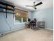 Bright home office with large window, desk, and ceiling fan at 6512 Porterfield Rd, Charlotte, NC 28226