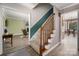 Inviting staircase showcasing neutral tones, complemented by views into the living spaces at 6512 Porterfield Rd, Charlotte, NC 28226