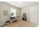 Bedroom with carpet, desk, chair, and window offering natural light at 6917 Rothchild Dr, Charlotte, NC 28270