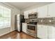Modern kitchen featuring stainless steel appliances, granite countertops, and ample cabinet space at 6917 Rothchild Dr, Charlotte, NC 28270