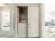 Laundry closet with sliding door features a washing machine and shelving unit at 6917 Rothchild Dr, Charlotte, NC 28270