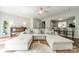 Spacious open-concept living room with a large sectional sofa and seamless transition to the kitchen at 6917 Rothchild Dr, Charlotte, NC 28270
