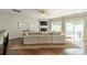 Bright living room boasts hardwood floors, a modern fireplace with TV, and sliding doors to the outdoor patio at 6917 Rothchild Dr, Charlotte, NC 28270