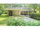 A close-up of the brick carport, showing the brick support columns and ample space at 7021 Linda Lake Dr, Charlotte, NC 28215