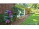 Lovely brick home with colorful hydrangeas and a brick patio at 7021 Linda Lake Dr, Charlotte, NC 28215