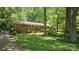 Charming single-story brick home featuring lush green lawn and established landscaping at 7021 Linda Lake Dr, Charlotte, NC 28215