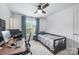 Cleanly decorated bedroom features desk, chair, single bed, neutral walls and a ceiling fan at 706 Evans Manor Dr, Weddington, NC 28104