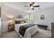 Cozy bedroom with natural light, a comfortable bed with decorative pillows, and stylish decor at 706 Evans Manor Dr, Weddington, NC 28104