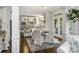 Open concept featuring white kitchen, stainless steel appliances, granite counters, and an adjacent breakfast nook at 706 Evans Manor Dr, Weddington, NC 28104