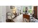 Cozy home office features traditional furniture, neutral decor, and natural light from a large window at 706 Evans Manor Dr, Weddington, NC 28104