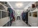 Organized walk-in closet with ample shelving and storage space at 706 Evans Manor Dr, Weddington, NC 28104