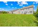 Expansive backyard features lush green grass and a patio area, providing ample space for outdoor enjoyment and entertaining at 7316 Hamilton Bridge Rd, Charlotte, NC 28278