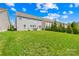 Spacious backyard with lush green grass, framed by mature trees, perfect for outdoor activities and relaxation at 7316 Hamilton Bridge Rd, Charlotte, NC 28278