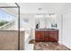 Bathroom featuring a double vanity with granite countertop, large mirror, and a separate bathtub at 7316 Hamilton Bridge Rd, Charlotte, NC 28278