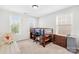 Charming bedroom with a loft bed, dresser, and two windows, providing ample natural light at 7316 Hamilton Bridge Rd, Charlotte, NC 28278