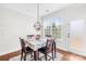 Cozy dining area with hardwood floors, natural light, and a modern chandelier at 7316 Hamilton Bridge Rd, Charlotte, NC 28278