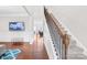 Open living room showcasing hardwood floors, a staircase, and comfortable seating area at 7316 Hamilton Bridge Rd at 7316 Hamilton Bridge Rd, Charlotte, NC 28278